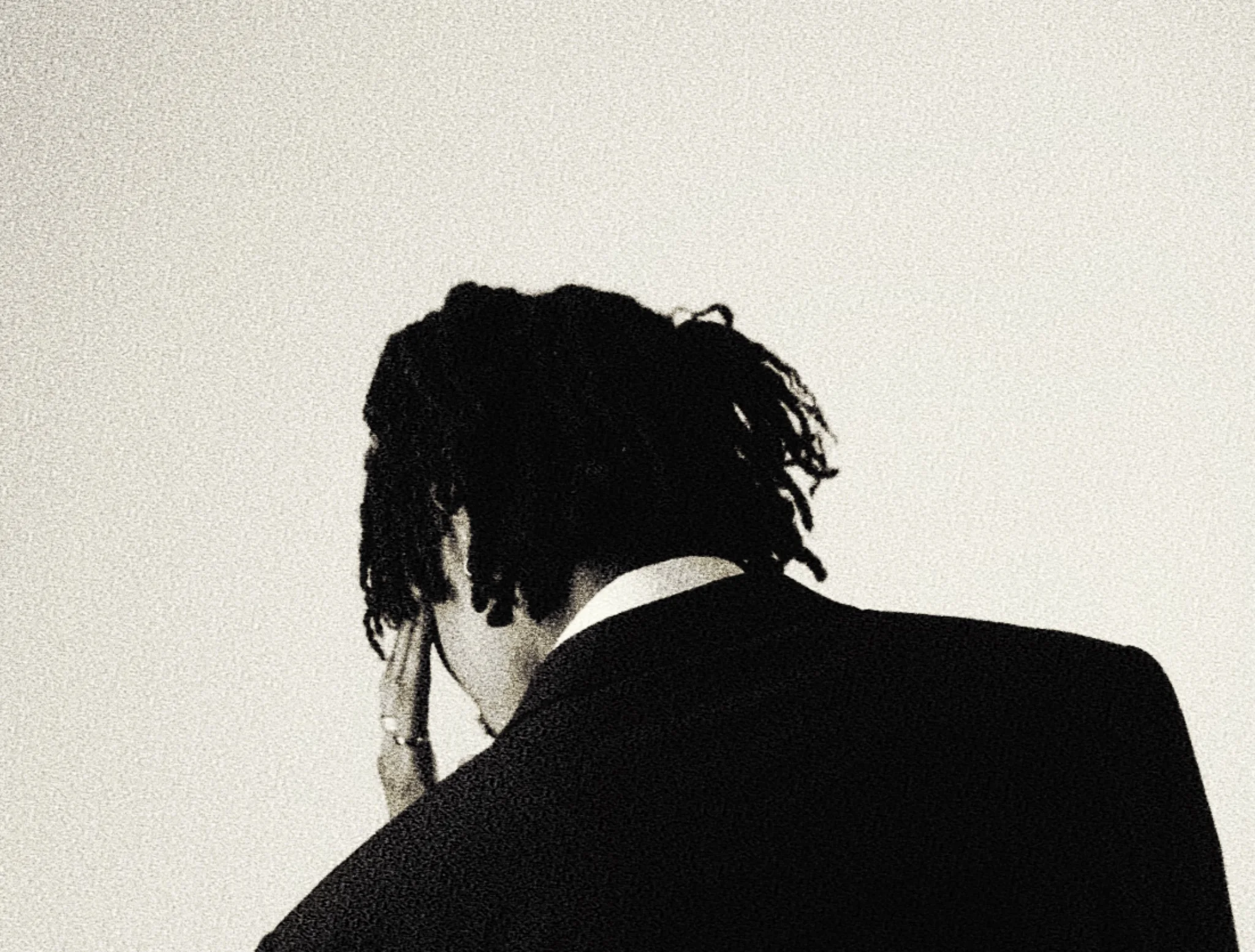 Back portrait of HIGHBREED in a suit