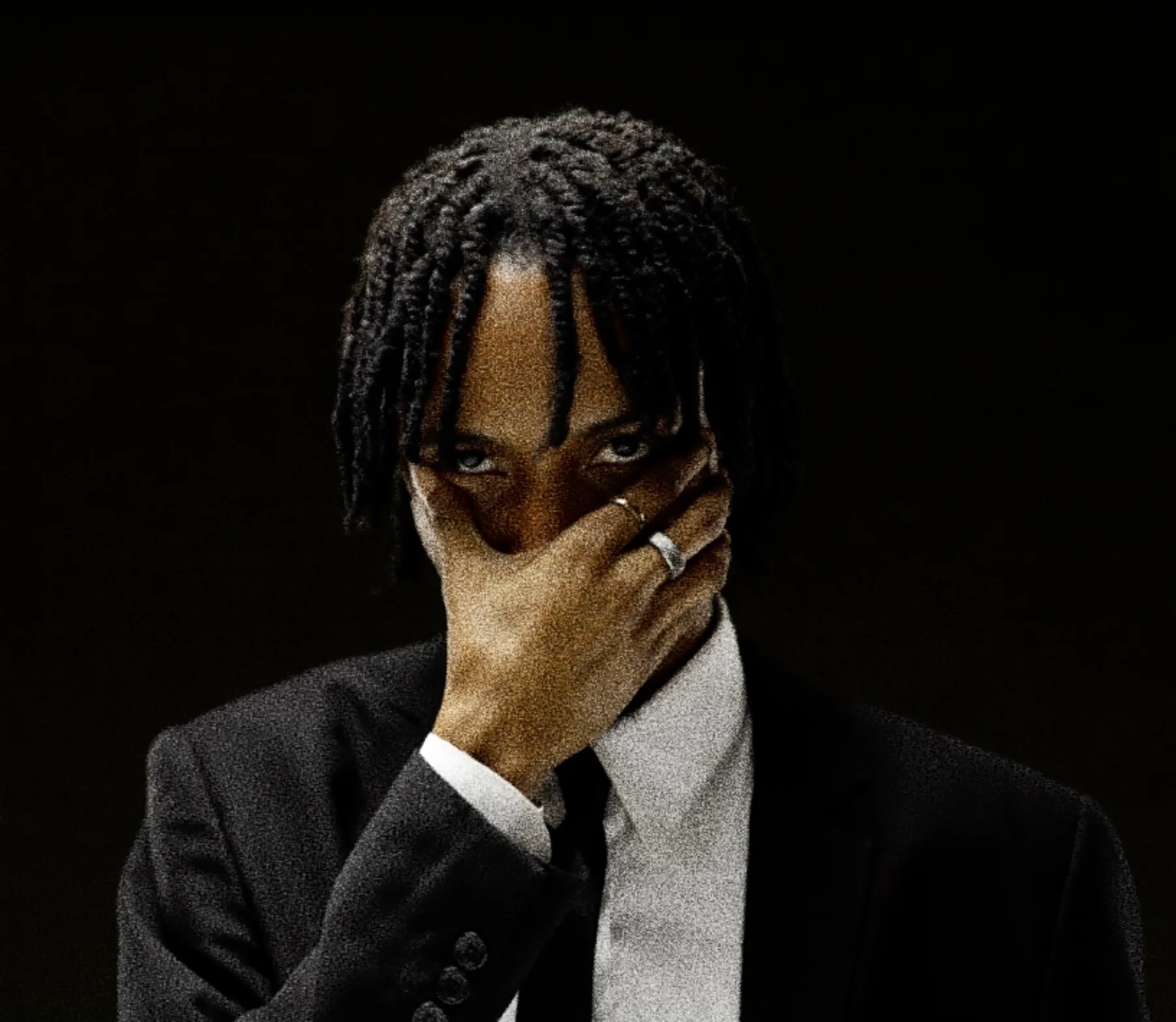 Close portrait of HIGHBREED against a black background